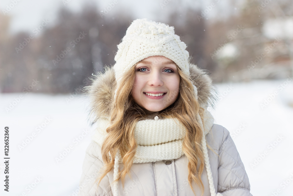 Close portrait of blonde girl in woolen hat, winter, outdoors. Close portrait of blonde girl in woolen hat, winter, outdoors.