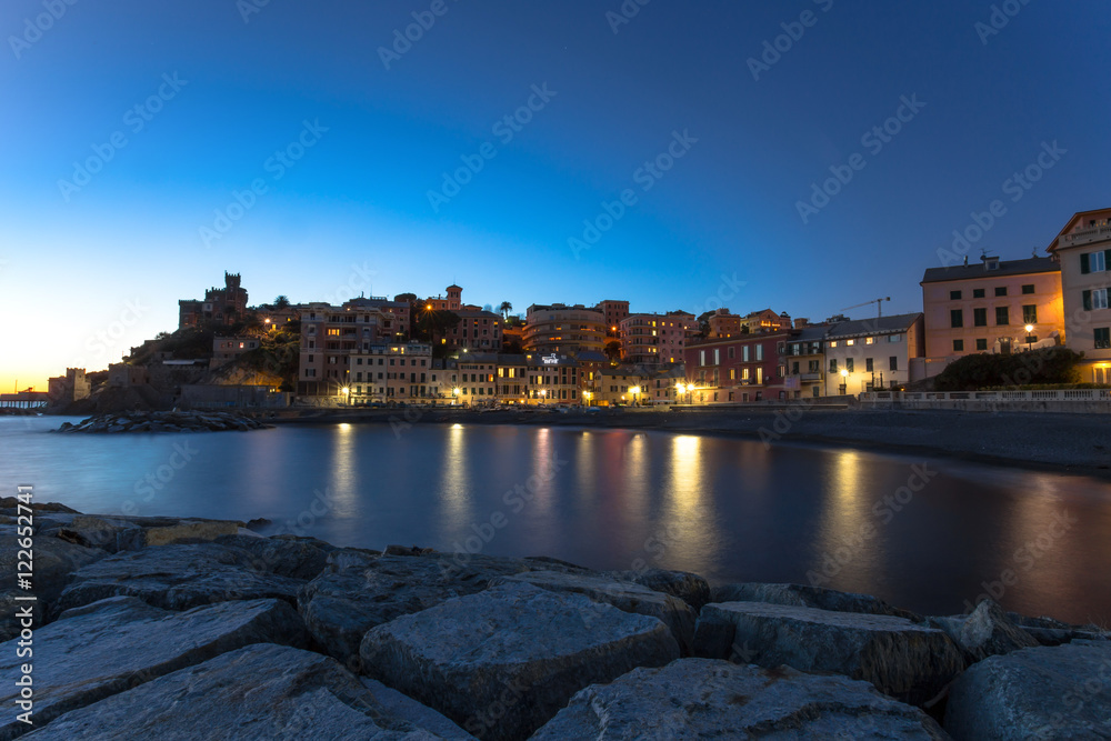 Obraz premium Long exposure in the sea village at night with color houses/ Genoa/Italy/reflexes/lights/ night