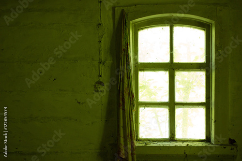 the window of an abandoned house