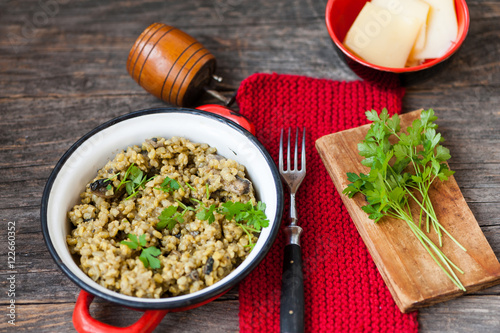 Risotto with brown rice, mushrooms and turmeric photo