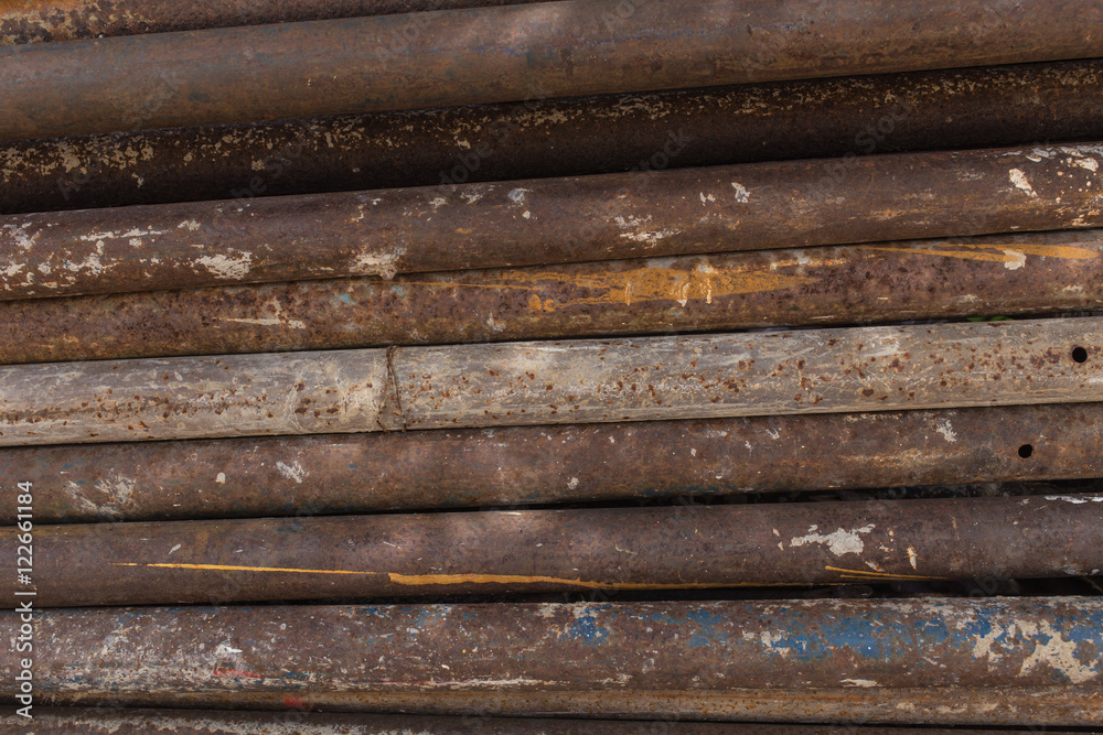 old rusty grungy metal or steel rods or bars in construction structure