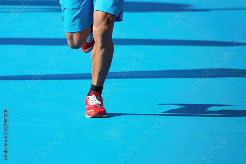 Marathoner running down the blue carpet
