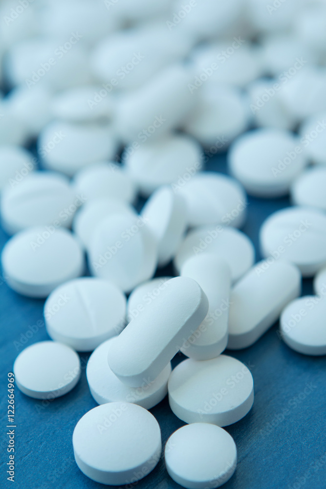 Top view of the Spilled white pills Top view of the Spilled white pills
