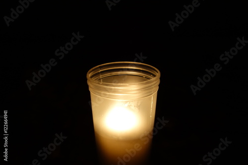 Memorial candle on black background
