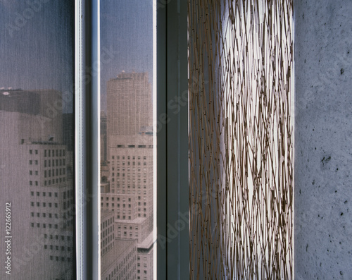 Flaky painted wall with skyscraper view 