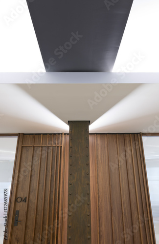 Wood paneled door and ceiling 