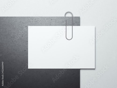 Paper sheet with business card and metal clip. 3d rendering