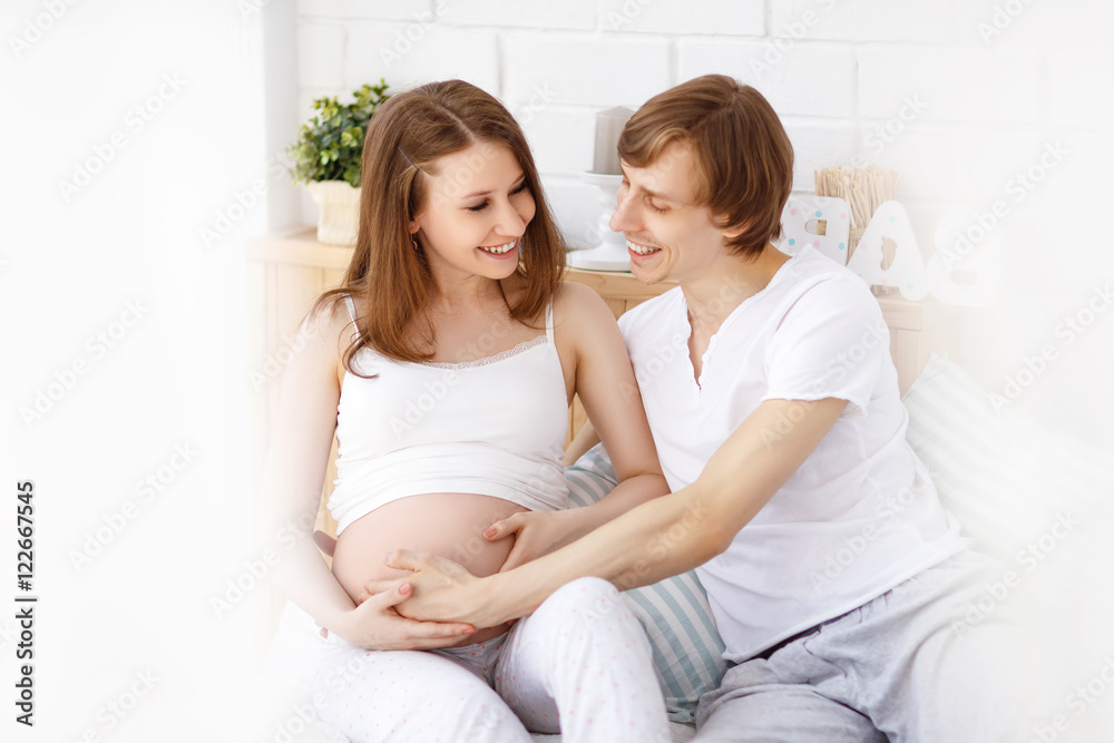 Happy future parents, dad and a pregnant mother in anticipation Happy future parents, dad and a pregnant mother in anticipation