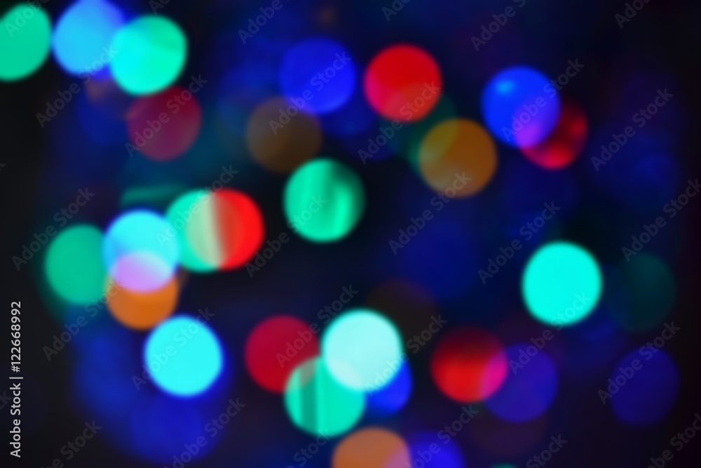 Blurred abstract xmas background, christmas texture from color lights on the Christmas tree. Blurred abstract xmas background, christmas texture from color lights on the Christmas tree.