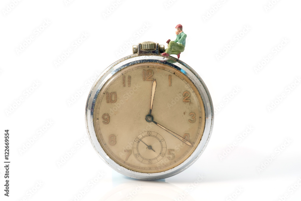 Toy worker / View of miniature toy worker on vintage clock. Toy worker / View of miniature toy worker on vintage clock.