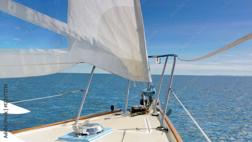 4K Serene Horizon View of Sailboat Sailing, Wind in Sales and Blue Sky and Ocean 4K Serene Horizon View of Sailboat Sailing, Wind in Sales and Blue Sky and Ocean