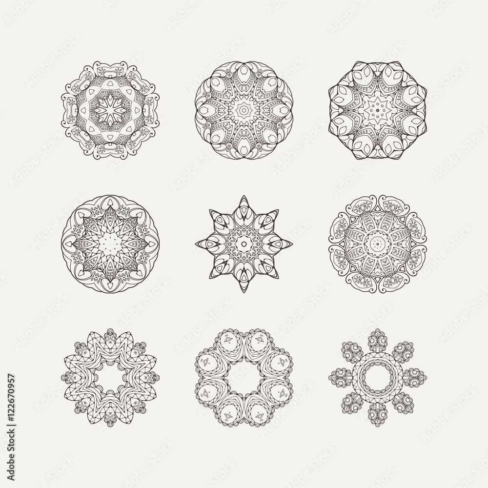 Set of ornate vector mandala symbols. Mehndi lace tattoo. Oriental weave.