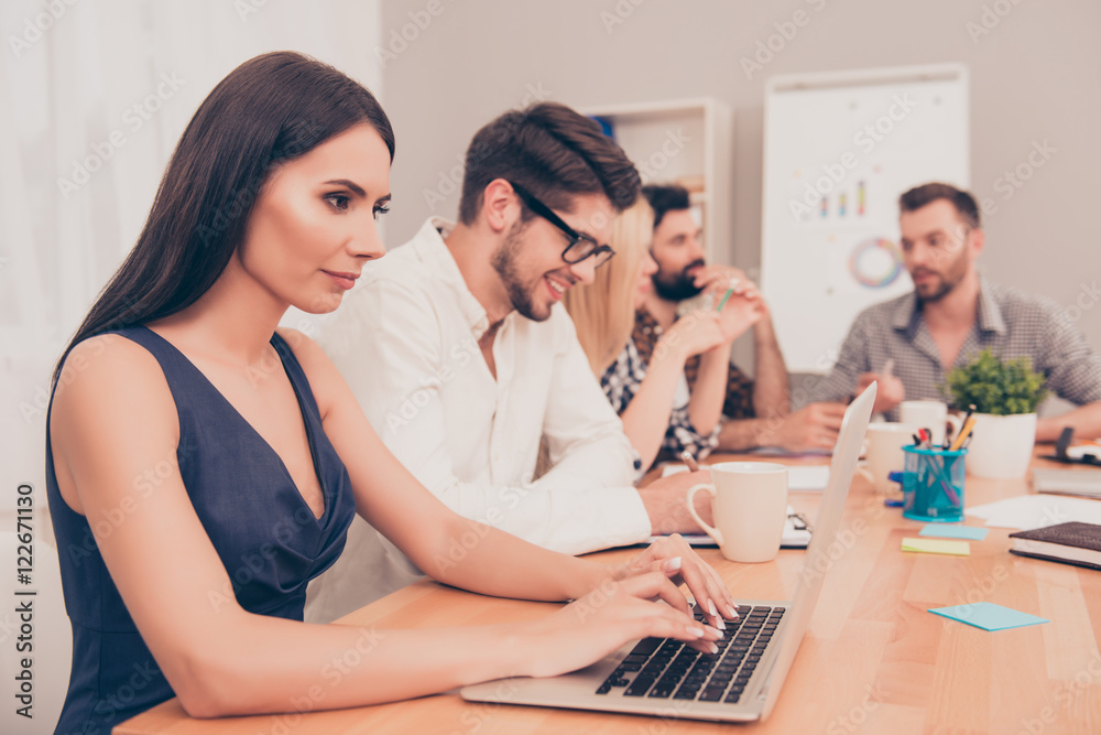hard work. beautiful businesswoman sitting at conference table w hard work. beautiful businesswoman sitting at conference table w