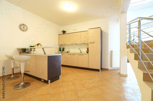 Interior of a kitchen with bar counter in a villa