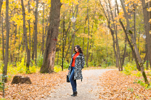 Girl with bag at autumn outdoor. © satura_