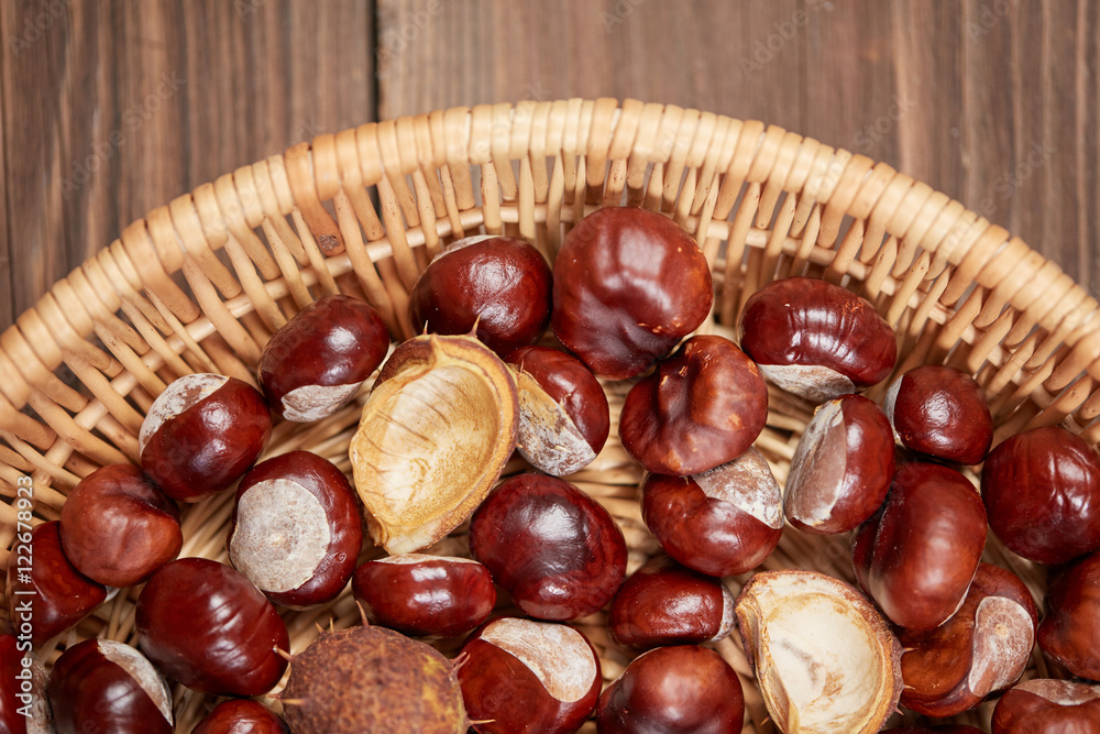 Chestnuts on a wooden table top view Chestnuts on a wooden table top view