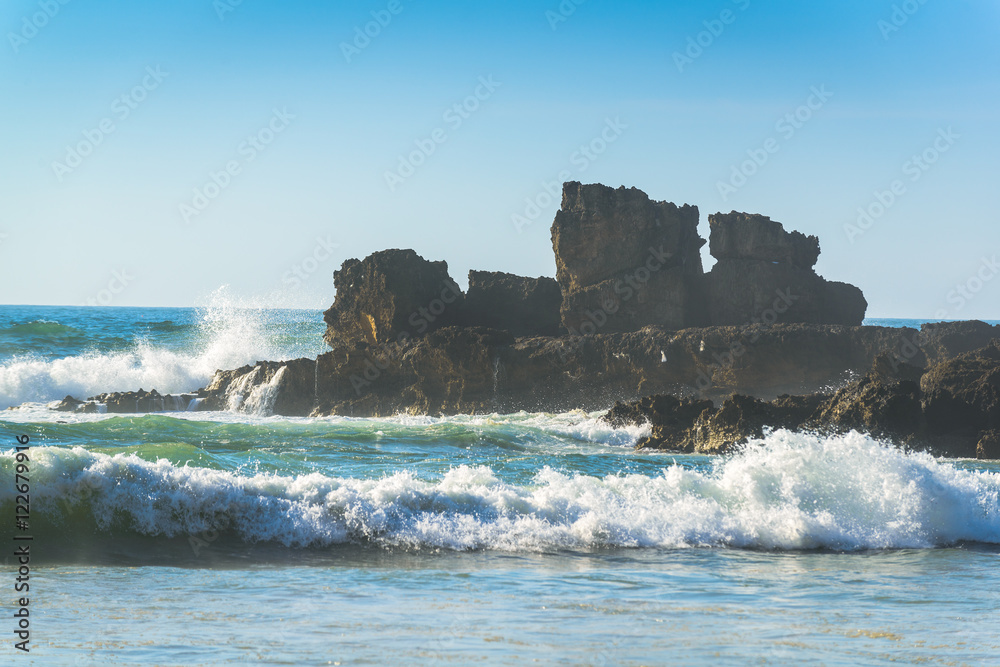 Rocks in the Atlantic Ocean near Praia do Castelejo-fantastic beach on the southwest coast of Portugal. Region Algarve