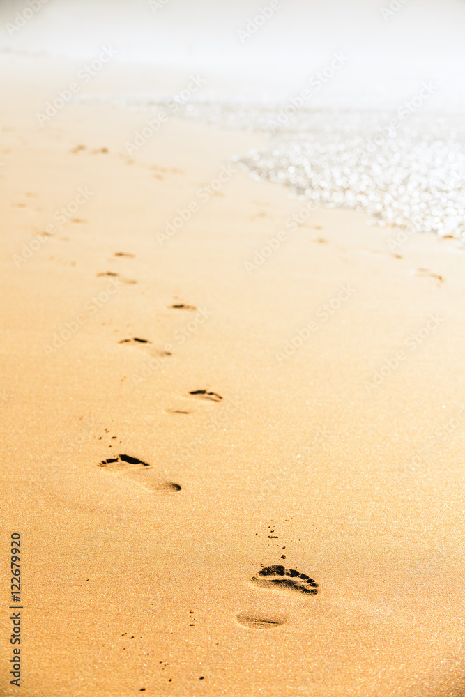 Footprints in the sand.Praia do Castelejo-fantastic beach on the southwest coast of Portugal. Region Algarve Footprints in the sand.Praia do Castelejo-fantastic beach on the southwest coast of Portugal. Region Algarve