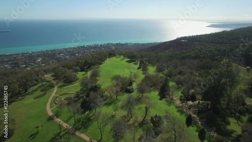 Flight over Seawinds Gardens toward suburban areas on Mornington Peninsula and Port Phillip bay on hot summer day. Melbourne, Victoria, Australia photo