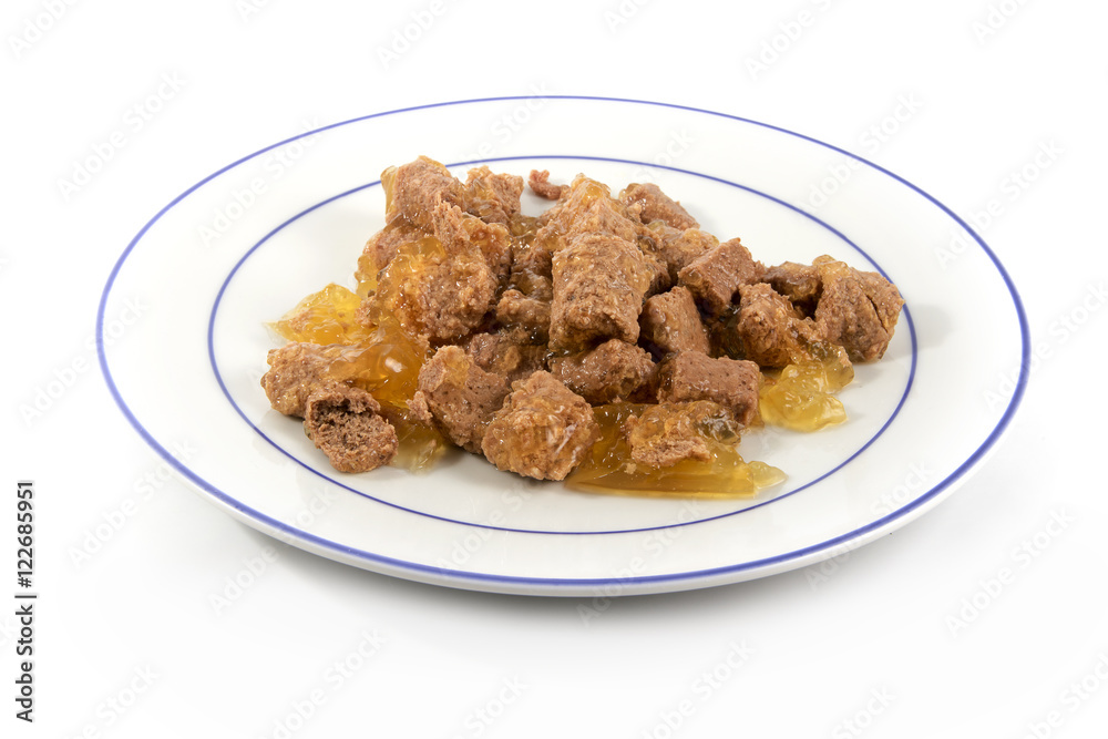 meal for cats or dogs, industrial canned wet food on a plate isolated on white meal for cats or dogs, industrial canned wet food on a plate isolated on white