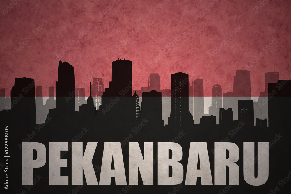 Fototapeta premium abstract silhouette of the city with text Pekanbaru at the vintage indonesian flag background