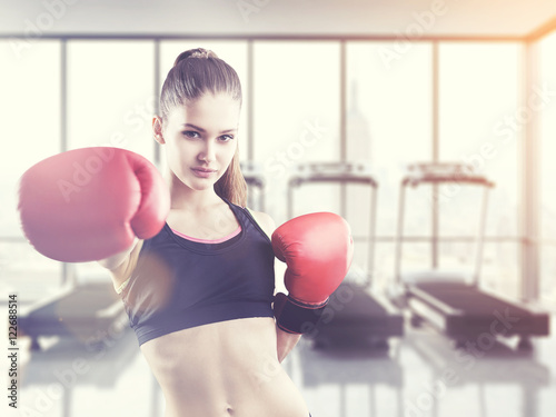 Woman boxer in a gym