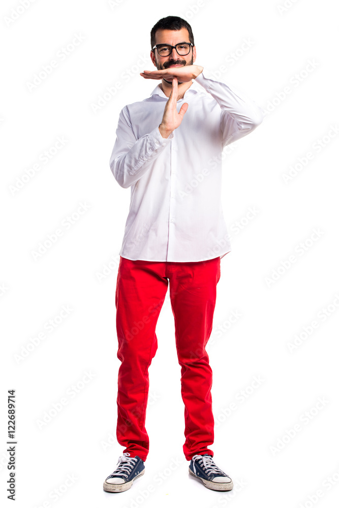 Handsome man with glasses making time out gesture Handsome man with glasses making time out gesture