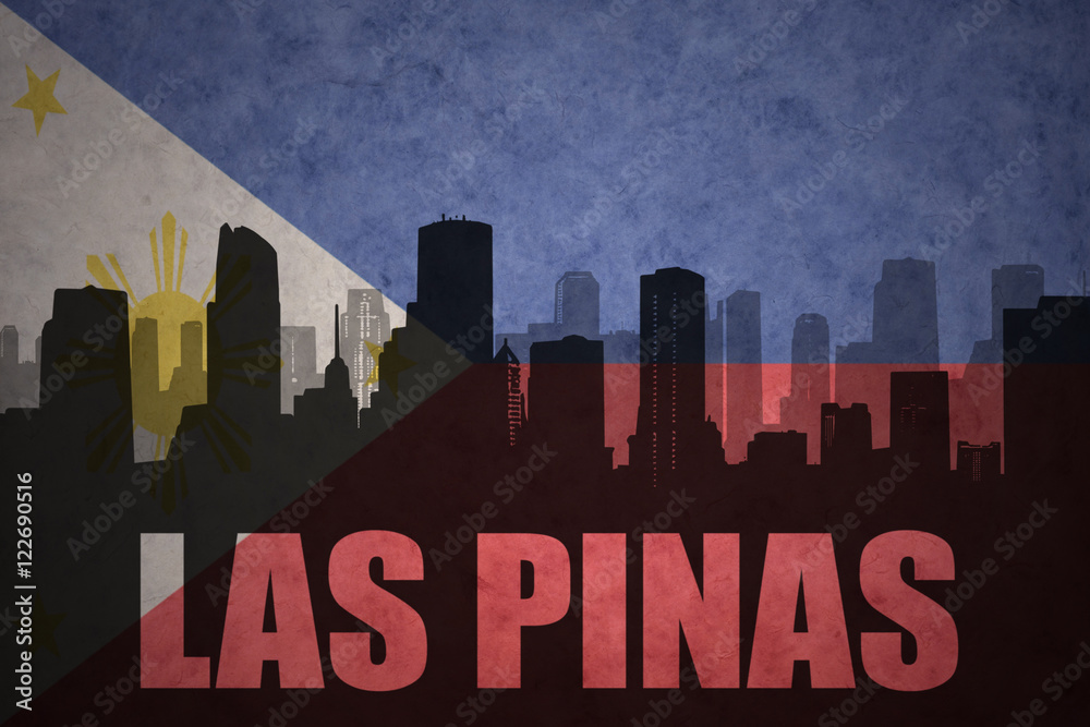 abstract silhouette of the city with text Las Pinas at the vintage philippines flag background