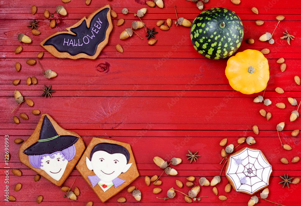 Funny ginger cookies for Halloween on red table. Halloween background. Free place for text. Top view.