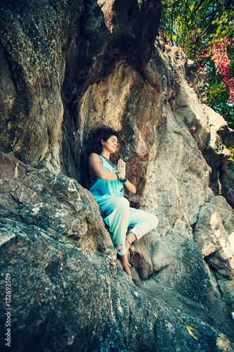 woman meditation on the rock