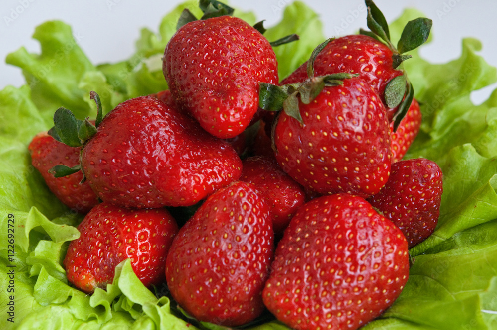 Berries strawberries on lettuce leaves Berries strawberries on lettuce leaves