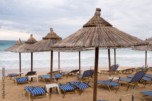 Fototapeta Naklejka Na Ścianę i Meble -  Thatch umbrellas on the beach in Greece