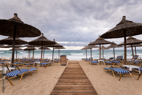 Thatch umbrellas on the beach in Greece