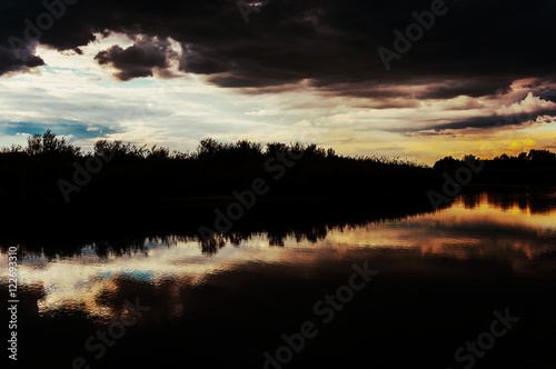 Dark sky reflected in lake