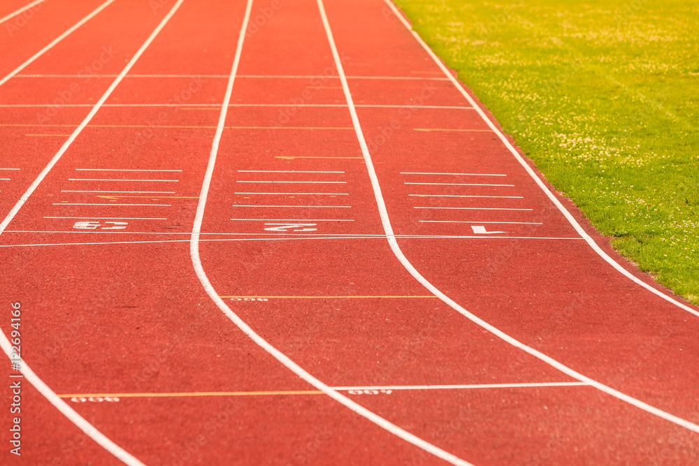 Red running track in stadium.