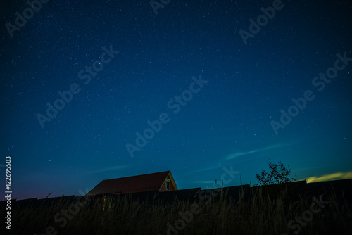 Night landscape with house under the starry sky