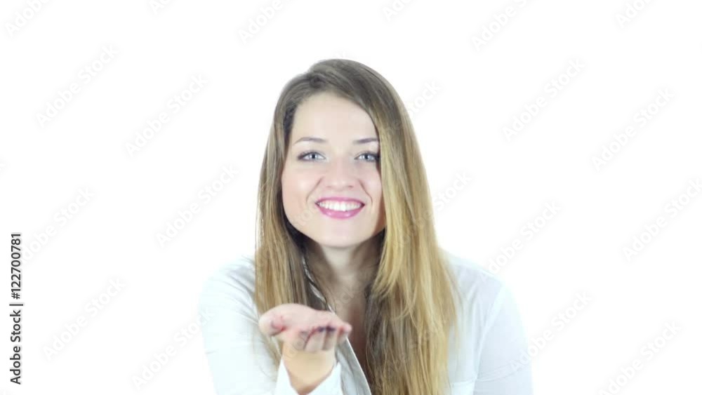 Flying Kiss by Young Beautiful Woman, White Background Flying Kiss by Young Beautiful Woman, White Background