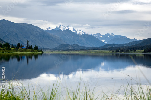 Fototapeta Naklejka Na Ścianę i Meble -  Reflection of hight mountain in crystal lake. Yazevoe lake. Alta