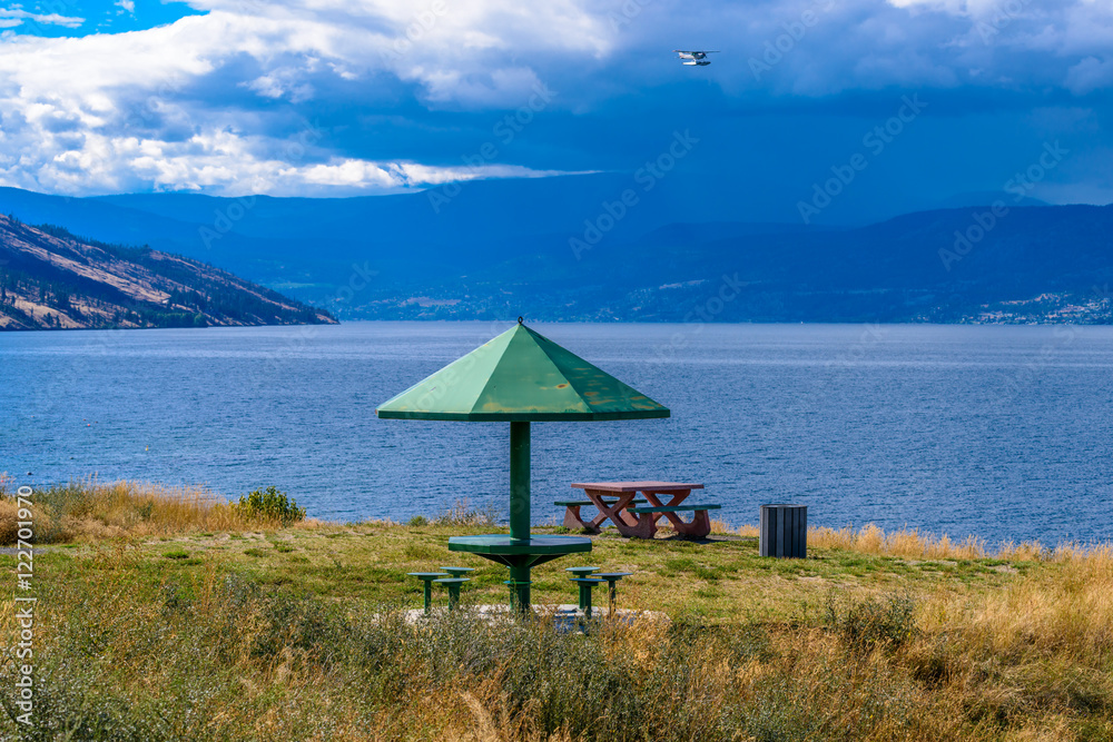 A picnic table with gorgeous view at Okanagan Lake, British Columbia, Canada. Lebanon Creek Park.