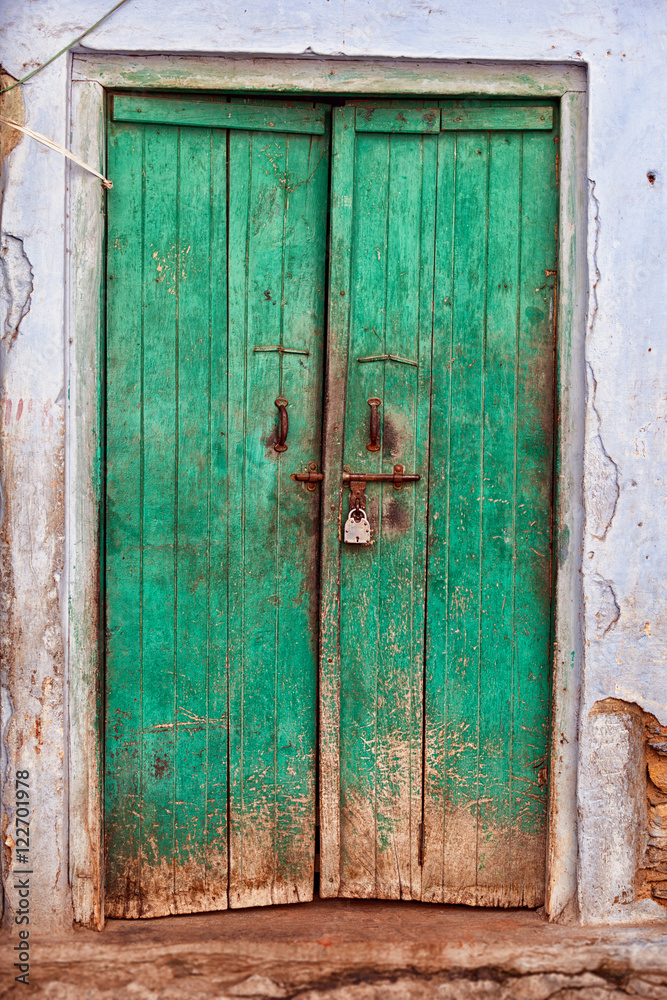 Ancient green wooden door, India