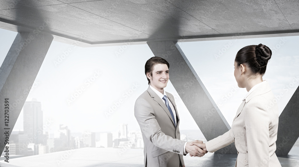 Fototapeta premium Business partners handshake . Mixed media