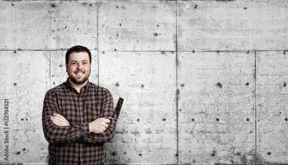 Handyman with tool in interior . Mixed media Handyman with tool in interior . Mixed media