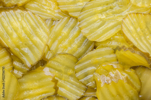 Dill pickle slices for use as a background.