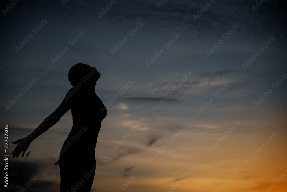 silhouette woman happy and sunset