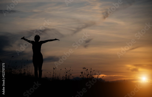 Woman happy at sunset. © stcom