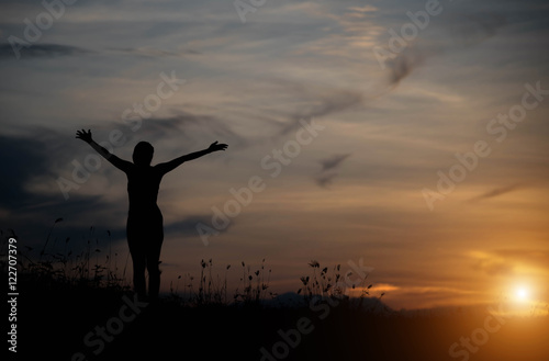 Woman happy at sunset. © stcom