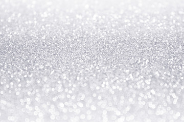 Elegant white and silver glitter sparkle confetti background or party invitation