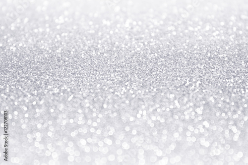 Elegant white and silver glitter sparkle confetti background or party invitation