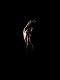Silhouette trace of a male ballet dancer on black