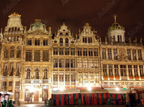 The Grand Place in the central square of Brussels. It is surrounded by opulent guildhalls and two larger edifices, the city's Town Hall, and the Breadhouse